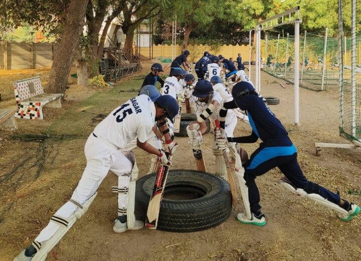 Kids cricket training warm-up session at GRP Sports Academy